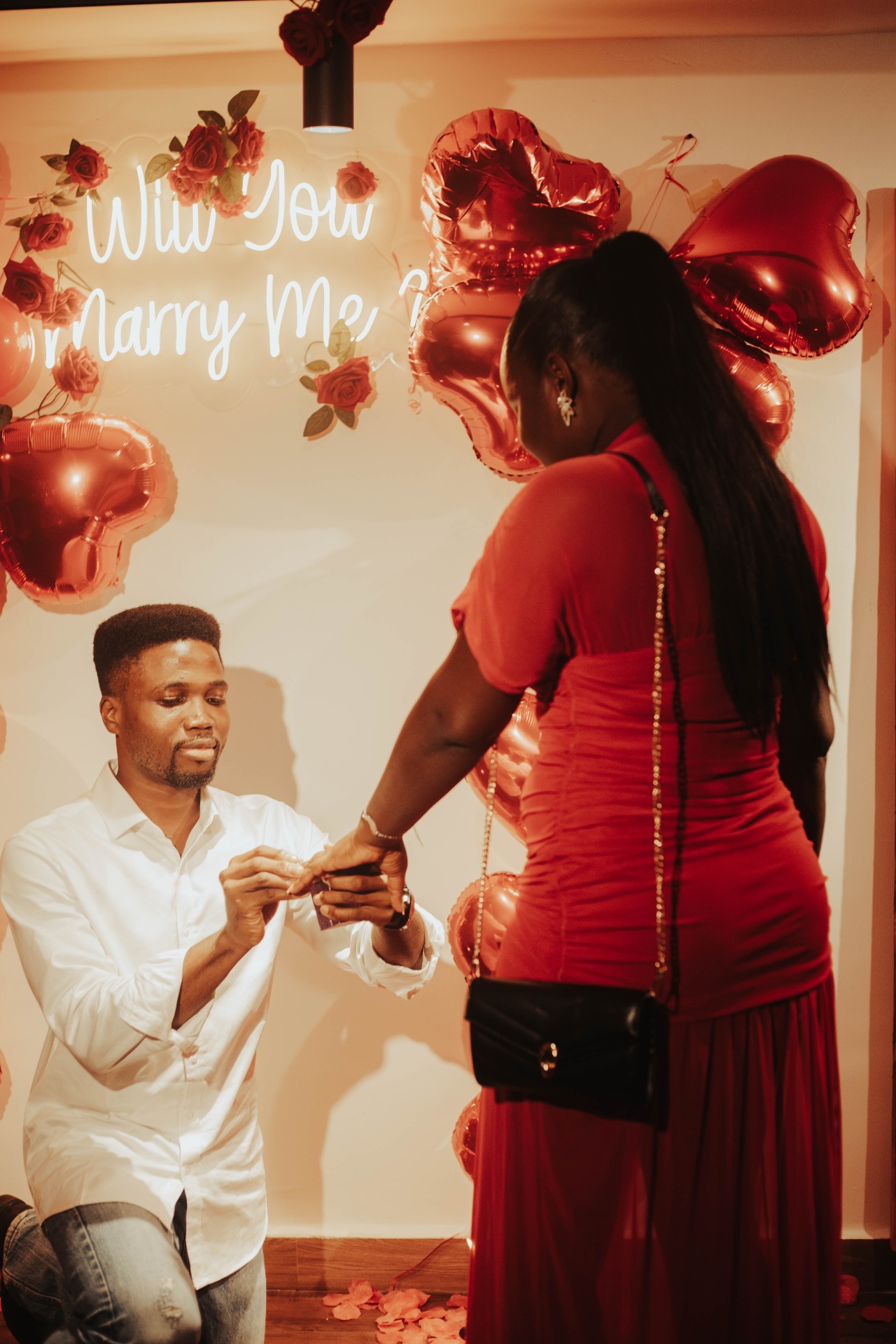 Kofo placing the ring on Fiye's finger